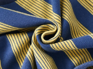Macro shot of navy blue and yellow striped knit fabric texture on the boy sweatshirt