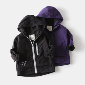 Detail of children's fleece-lined hooded jackets with dinosaur embroidery and zippers
