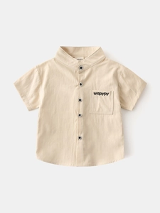 Boys' beige short sleeve shirt with V-neck, embroidered pocket and black buttons