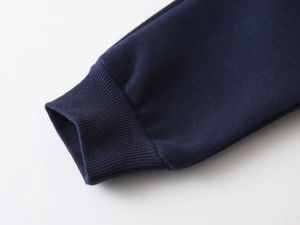 Close-up of dark blue ribbed cuffs on thick knit fabric for children sweatshirt set