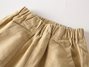 Detailed view of kids khaki casual pants featuring elastic waistband and side pockets