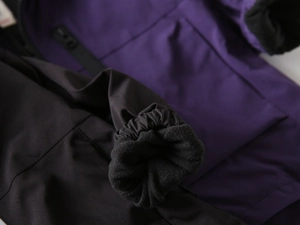 Close-up of children's jacket elastic cuffs with warm thick black fleece lining
