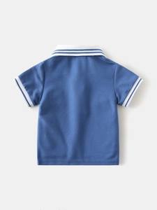 Royal blue boy's polo shirt with white striped collar and pique cotton texture