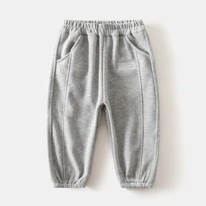 Close-up of boys thick fleece sports pants with elastic waist and GOODTHING print