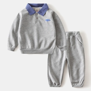 Detail of gray kids sweatshirt with blue checkered collar and Game Changer patch
