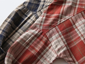 Close-up of boys plaid cotton shirts showing premium stitching and fabric texture