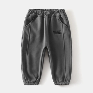 Detail view of boys thick fleece sport pants featuring elastic waistband and GOODTHING embroidery