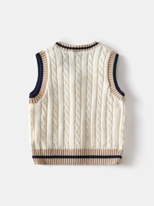 Knitted kids sweater vest in cream with cable knit pattern and striped trim back view