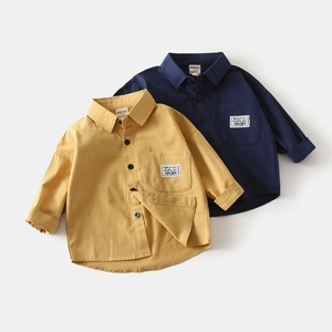 Detailed flat lay of boys' cotton long sleeve shirts in ginger and navy blue with chest labels