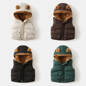 Detail showing plush lamb wool lining and 3D bear ears on hooded winter vests for kids