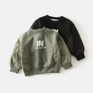 Detail of boys' sweatshirt with quilted diamond pattern sleeves and ribbed cuffs