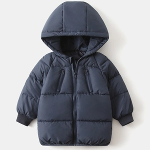 Detail of kids winter puffer jacket featuring quilted padding, zipper pockets and ribbed cuffs