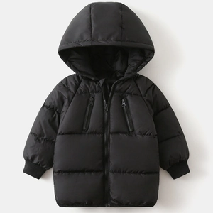 Detail of kids black hooded puffer jacket showing ribbed cuffs and zipper pockets