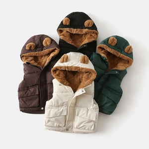 Detail of hooded kids puffer vest with bear ears and thick warm fleece lining texture