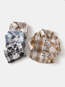 Classic long-sleeve plaid shirt for boys with wood buttons and chest pocket detail