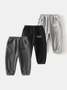 Three-pack of warm boys fleece joggers in black and grey with letter print on sides