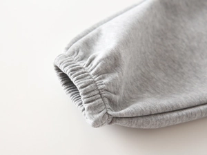Macro shot of grey ribbed elastic cuffs on high-quality knit cotton children clothing