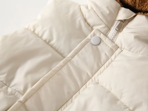 Detail of hooded winter vest with fleece lining, zipper and metal snap buttons