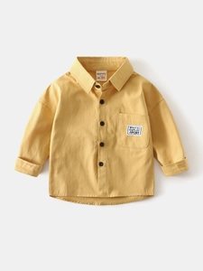 Ginger yellow long-sleeve cotton shirt for boys with stylish pocket label and black buttons