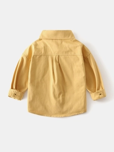 Back view of a ginger yellow long sleeve cotton shirt for boys with a classic yoke design