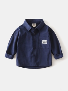 Flat lay of navy blue long-sleeved cotton shirt for boys with stylish chest brand tag