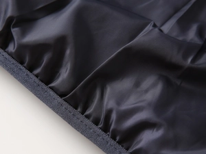 Detailed view of kids puffer jacket windproof elastic cuffs and water-resistant fabric