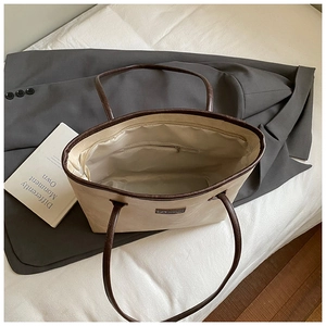 Top view of large tote bag showing spacious interior with zipper pocket and cream lining