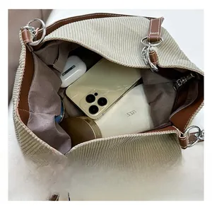 Detail view of large corduroy tote bag showing spacious interior and brown lining