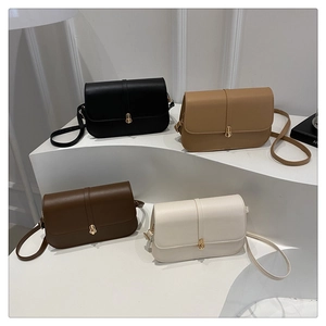 Row of leather baguette bags in black, khaki, brown, and cream with gold metal locks