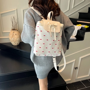 Lace backpack with red bow embroidery and pearl pendant in a stylish cream finish