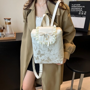 Sac à dos blanc à motif papillon avec bords volantés, nœud doux et perle élégante