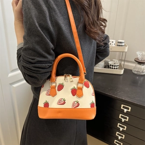 Chic shell-shaped handbag with strawberry print and orange leather straps for women