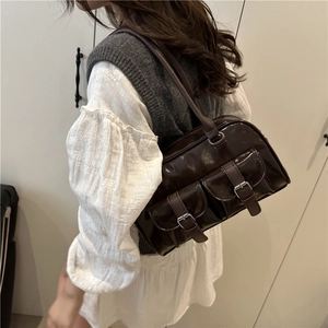 Vintage dark brown gloss bowling bag with dual front pockets and silver buckle accents