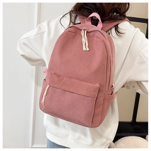 Detailed back view of a pink corduroy backpack with cotton rope zipper on a model