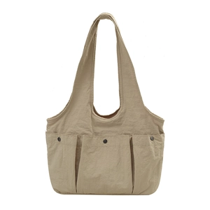 Khaki large capacity nylon tote bag with three front button pockets and minimalist design