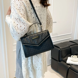 Elegant black woven texture crossbody bag with gold fashion hardware for women