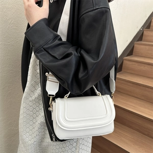 Minimalist white semi-circle saddle bag with U-shaped embossing and wide strap