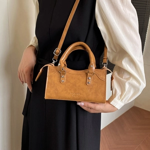 Retro brown pillow-shaped PU leather handbag with adjustable crossbody shoulder strap