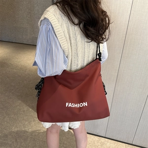 Large brick red nylon tote bag with fashion print and thick rope shoulder strap