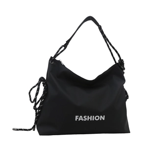 Large black nylon hobo shoulder bag with FASHION print and woven rope straps