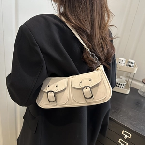 Minimalist beige baguette shoulder bag with double pockets and metal chain strap detail