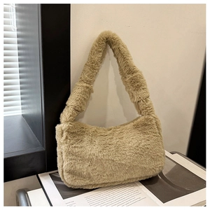 Detail of soft beige faux fur texture on a plush shoulder bag with matching thick strap