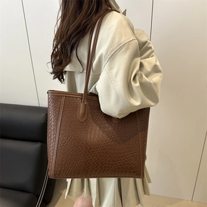 Large dark brown woven tote bag for women with dual top handles for shoulder use