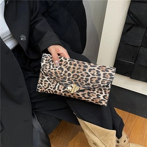 Fashionable leopard print envelope clutch bag with heart-shaped golden buckle detail