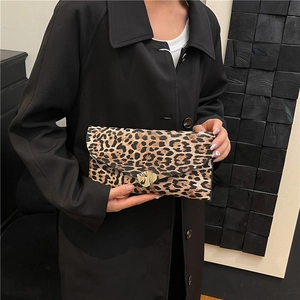 Fashionable leopard print envelope clutch bag with a gold heart clasp for women