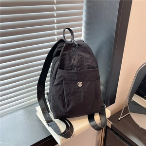 Fashionable black nylon mini backpack with pleated texture and silver metallic M logo