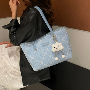 Light blue bohemian quilted tote bag with a cute white cloud plush pendant and shoulder strap