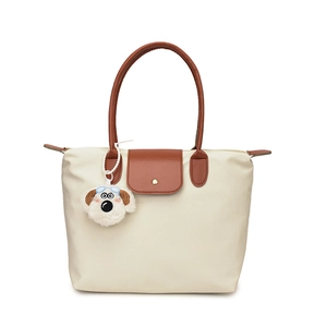 Sac fourre-tout en nylon beige avec anses en cuir marron et pendentif chien peluche