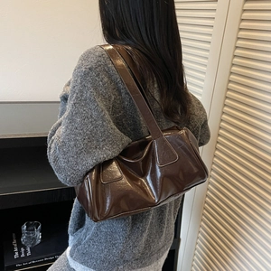 Deep brown glossy leather baguette underarm bag for women with wide shoulder strap