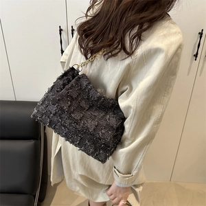 Fashionable tweed chain shoulder bag in dark grey with elegant gold strap detail
